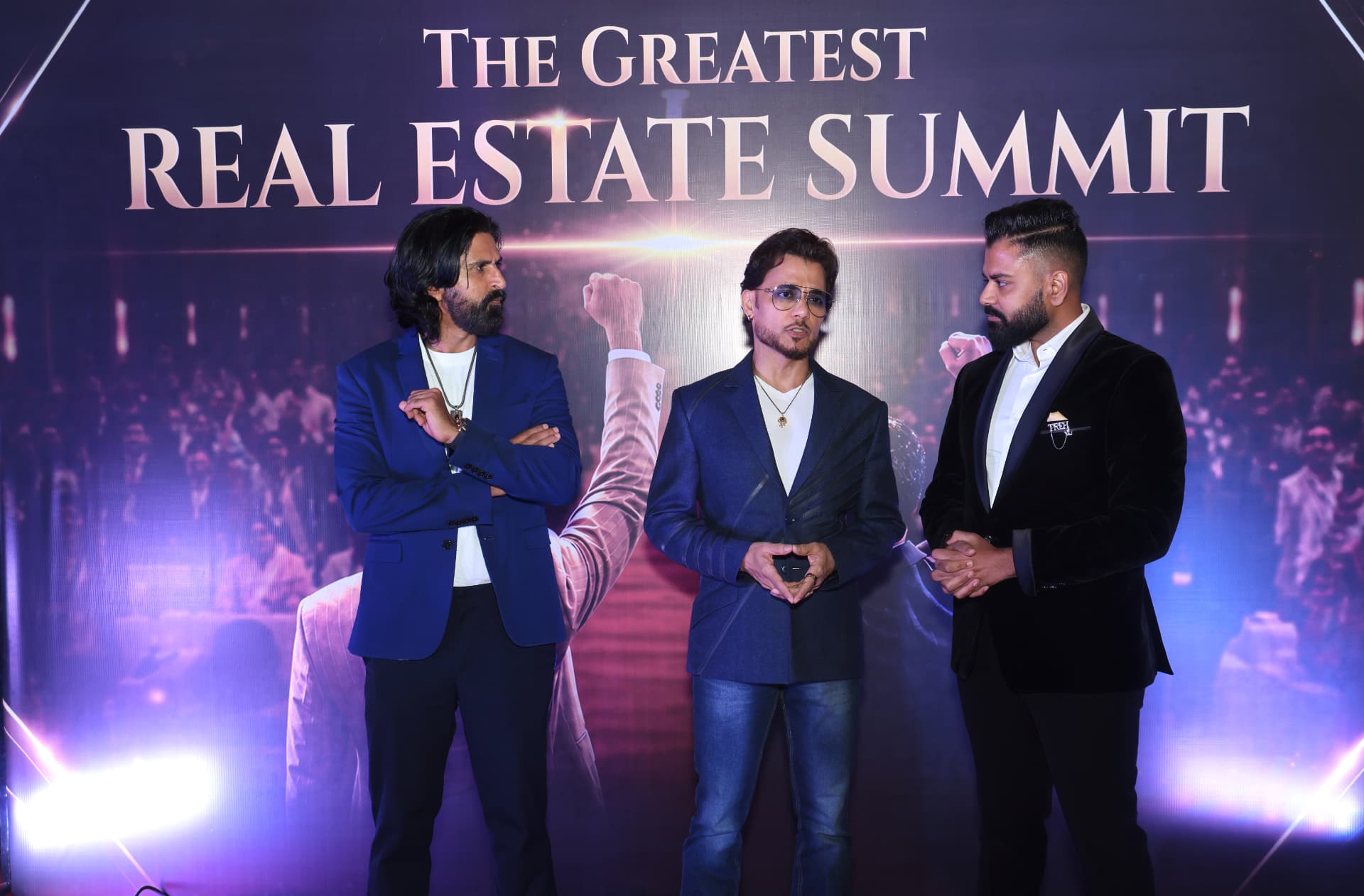Dev Gadhvi on stage with Tiger Shroff at The Greatest Real Estate Summit